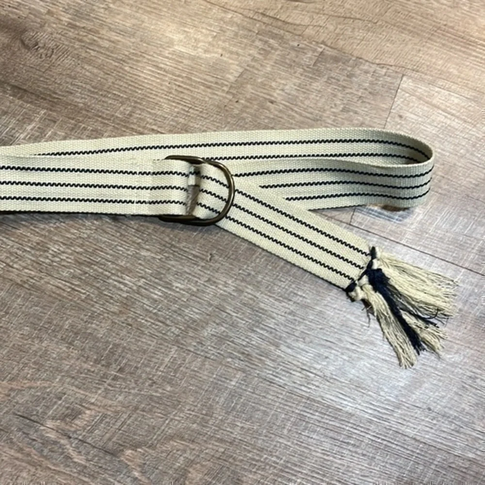 Natural fiber handcrafted loom woven tan and navy belt fits up to 38 inches